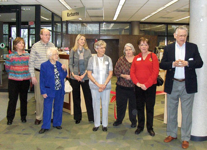 Listening to their president John Finneman (at far right) speak during the Feb. 29 ceremony are Chantilly Friends and board members (from left) Elise Serrano, Dave Price, Rosannah Moser, Nora Britch, Lois Price, Bonnie Dinkin and Barbara Levermann.
