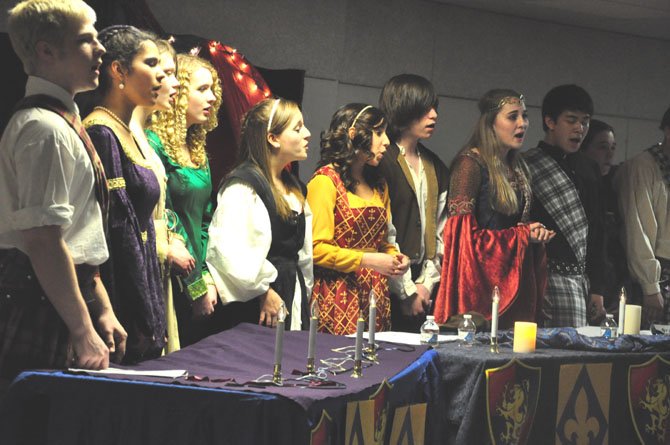 Members of the McLean High School Madrigals perform in the choral department’s annual Boar’s Head Feast at the school Saturday, March 10. 