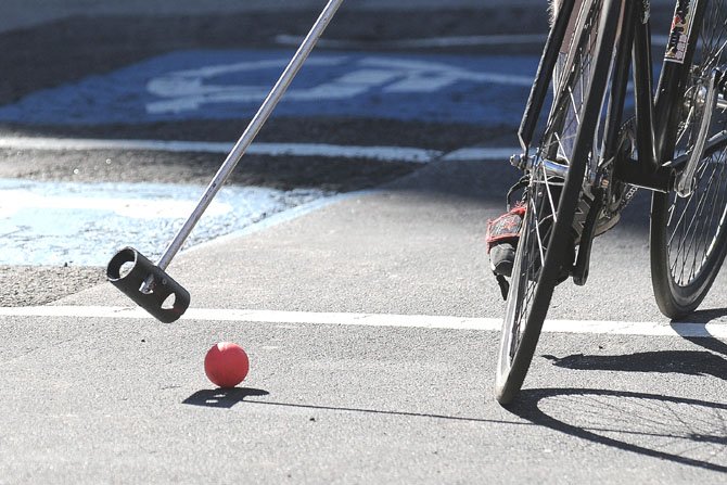 Members of DC Bike Polo pick-up a game outside the Diamond Derby Racecourse on Saturday afternoon.