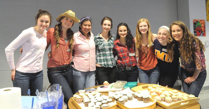 Allison Klem, Eva Muszynski, Tricia Leano, Caroline Keating, Frankie Zito, Gennie Gilson, Clara Balestrieri and Anna Merlene help out with the refreshments during a break in the dance.