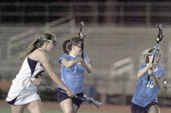 Yorktown junior midfielder Jennie Basile (1) scored four goals for the Patriots during their season opener against West Springfield on March 12.