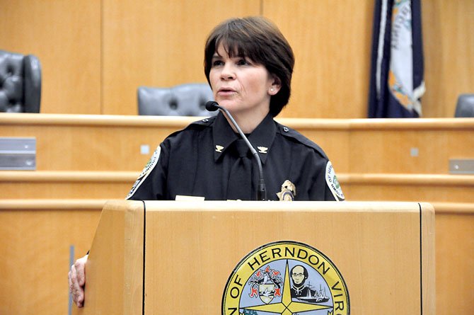 Col. Maggie A. DeBoard, Chief of the Town of Herndon Police Department, addresses town residents and staff after being sworn in Tuesday, March 6. 