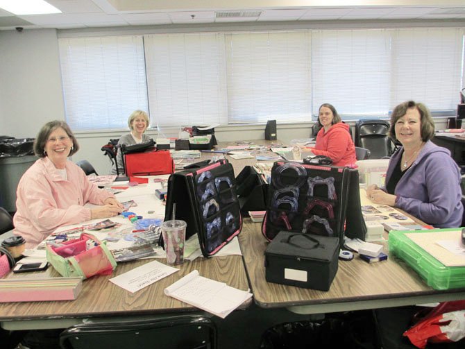 Scrapbooking friends Brenda Belote, Judy Barto, Marnie Sturm and Sherry Hayden look forward to dedicating a weekend to socializing with like-minded hobbyists.