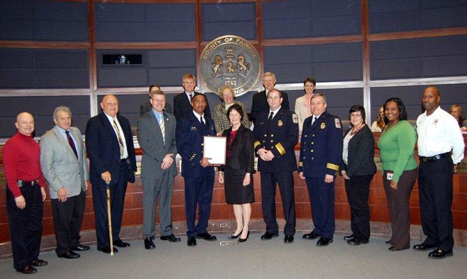 Capt. Willie Bailey, fifth from left, is honored March 6 by Sharon Bulova and the Fairfax County Board of Supervisors for his more than 1,000 hours of volunteer service to the community.