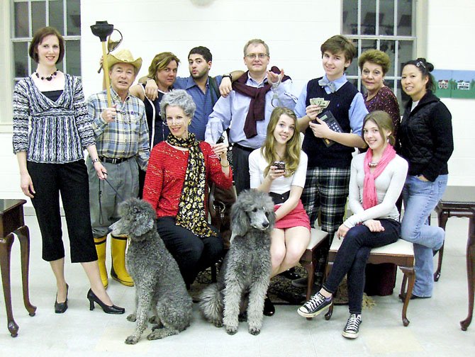 The cast of "Maid for Dogs," (standing, from left) Stephanie Lawrence, Charles Hoffman, Elizabeth Vittori, Walid Chaya, Jim Manchester, Maxwell Snyder, Helen Rusnak and Charlotte Yakovleff, and (sitting, from left) Lynne Strang, Andie Matten and Roxy Matten. Dogs are Abby and Izzy.