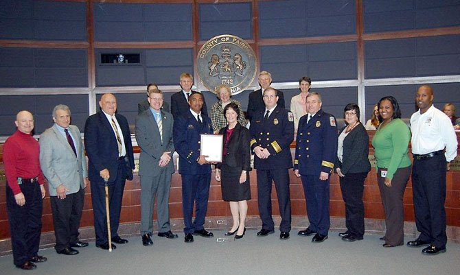 Capt. Willie Bailey, fifth from left, is honored March 6 by Sharon Bulova and the Fairfax County Board of Supervisors for his more than 1,000 hours of volunteer service to the community.