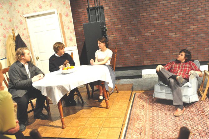 From right, Damian Leverett as Eddie Carbone, Siena Richardson as his wife Beatrice as they welcome illegal immigrants from Italy. Rodolpho, played by Max Johnson and Marco, played by John Williams in the McLean Theatre Company’s presentation of "A View From the Bridge."