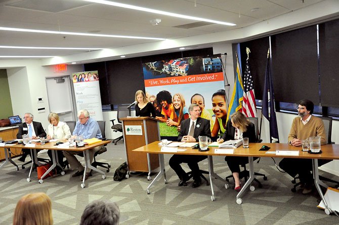 From left, Reston Association board of directors candidates Richard Chew, Eve Thompson, John Farrell, Michael Sanio, Donna Miller Rostant and Tom Vis at the RA headquarters Wednesday, March 14. Thompson, Farrell, Sanio, Miller Rostant and Vis are running for two open at-large seats, while Chew is running unopposed for the South Lakes district seat. 