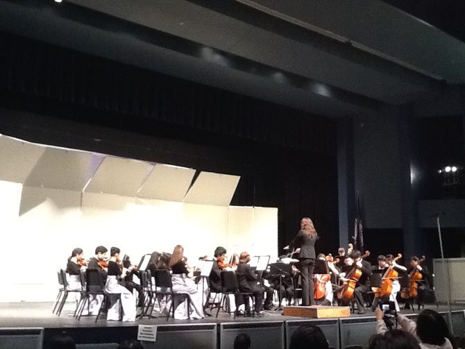 Bo-Min Son conducts the Cooper Middle School Symphonic Orchestra.

