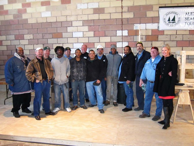 GenOn representatives joined Alexandria Seaport Foundation staff and apprentices February at the ASF workshop. From left: Darius Ligon (ASF), Kent Barnekov (ASF), Howell Crim (ASF), Chris (ASF apprentice), Chuck Kania (GenOn), Michael (ASF apprentice), Dale Hall (GenOn), Steve Hernandez (ASF), Dewayne Crone (GenOn), Maurice (ASF apprentice), Gene Davis (GenOn), Nick Folden (GenOn), Mark DeBoe (GenOn) and Kathy Seifert (ASF).
