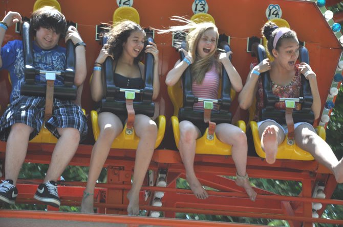 From left, Brian Hernandez, 14, Sarah Sinnas, 14, Hanna Andrews, 14 and Apiding Osika, 13, ride the Full Tilt at McLean Day. This year’s festival will take place May 19. 