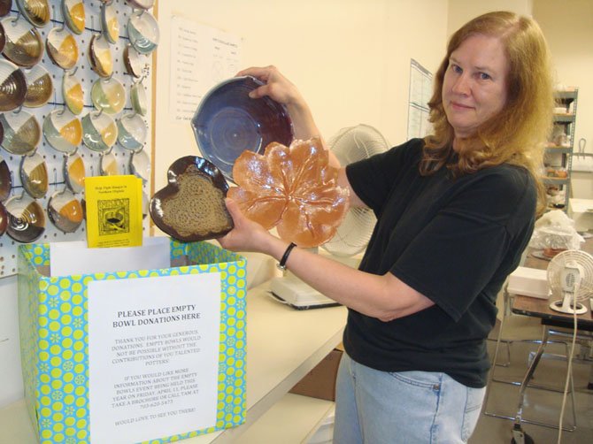 Deb Joder, potter at the Reston Community Center, shows three bowls made for the "Empty Bowls" hunger relief event on Friday, April 13, at Floris United Methodist Church.