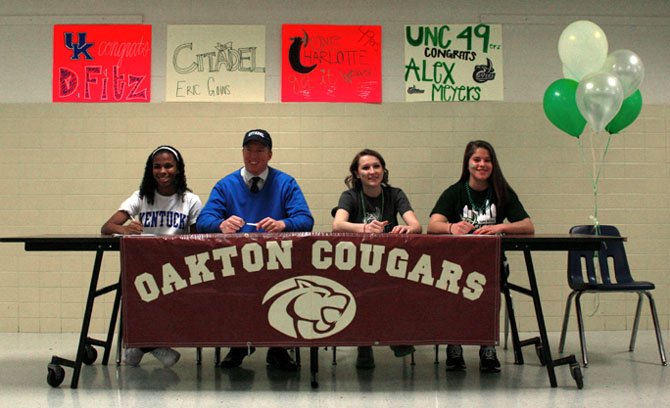 Four Oakton High School student-athletes celebrated their National Letters of Intent at a reception in their honor last month. From left to right: Danielle Fitzgerald, who will play soccer at Kentucky; Eric Goins, set to play football at The Citadel; and Alex Weaver and Alex Meyers, both of whom will play soccer at the University of North Carolina-Charlotte.