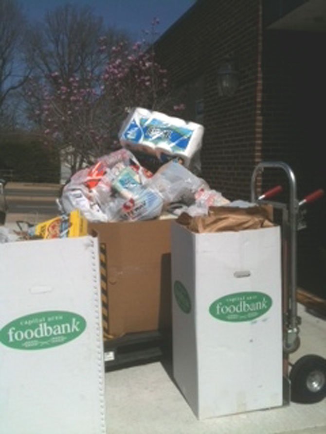 Coldwell Banker staff in its Arlington office collected over 900 pounds of food and supplies for the Capitol City Food Bank.