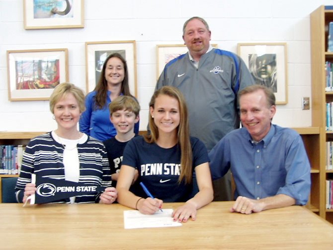 West Potomac senior Sarah Jane Underwood will run for Penn State University. Pictured from left to right are: (first row) Mary Underwood (mother), David Underwood (brother) Sarah Jane Underwood, Dave Underwood (father), (second row) Coach Jenn Dietz, DSA Aaron Helmick.