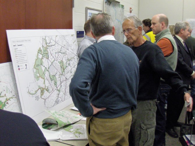 Local residents peruse maps of existing county bike trails.