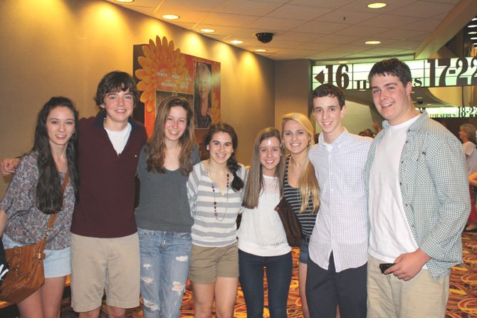 Quinn Hynes, second right, with friends at AMC opening weekend of the Hunger Games. Hynes’ character is featured in the first minutes of the film.
