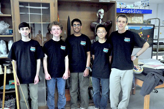 From left, Longfellow eighth graders Ryan Golant, Ross Dempsey, Tarun Kamath and Keaton Lee, members of the school’s science bowl team, with science teacher James Bradford. The team will be competing in the National Science Bowl in Washington, D.C. later this month. 