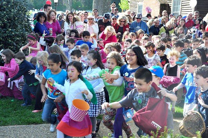 Children are unleashed to the Great Falls Village Green to hunt for Easter eggs Sunday, April 1 during the annual egg hunt. 