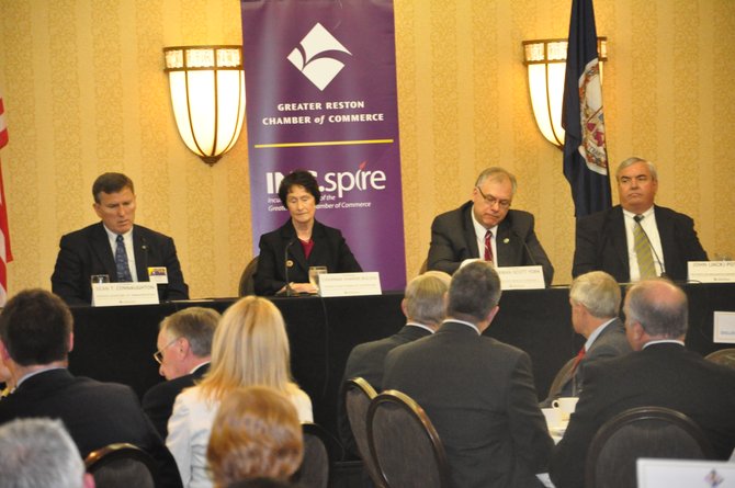 From left, Virginia Secretary of Transportation Sean Connaughton, Fairfax County Board of Supervisors Chair Sharon Bulova, Loudoun County Board of Supervisors Chair Scott York and Metropolitan Washington Airports Authority President Jack Potter speak at a Greater Reston Chamber of Commerce event Wednesday, March  28.