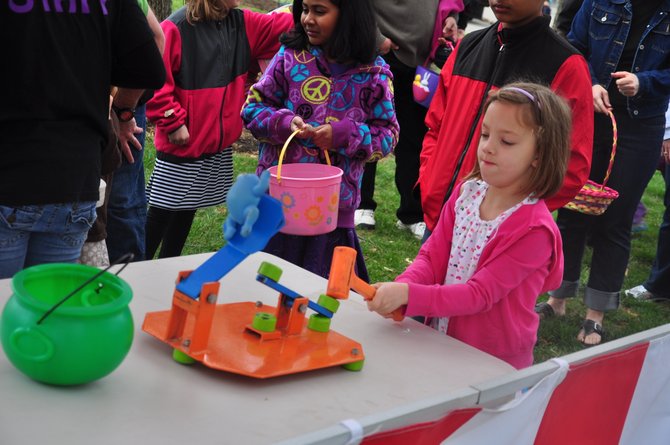 Sarah Culver, 7, plays a game during the Eggnormous Egg Hunt at Brown’s Chapel Park Saturday, March 31. 