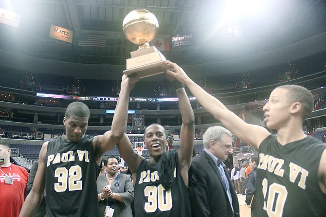 Paul VI High senior Coleman Johnson, Tilman Dunbar and Patrick Holloway hoist up the City Title trophy. After going undefeated in the WCAC and winning the Virginia Independent Schools Championship, the Panthers capped their outstanding season by defeating Coolidge at the Verizon Center to win the City Title. 