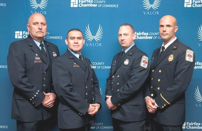 Technician Clay Slaymaker, Technician Edwin Flores, Firefighter Brendan Downing and Lt. Aron Corwin were honored March 21 for their heroism during a swift water rescue in Lorton last September.