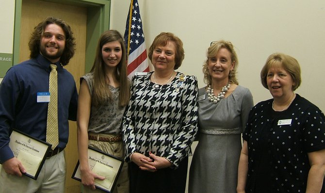 Vienna Students Win DAR Awards – from left: CJ Reimann of Oakton High School and Elizabeth Leavitt of James Madison receive their DAR Good Citizens Awards from Fairfax County Chapter Regent Elizabeth Bays and Good Citizens committee co-chairmen Amy Cartwright and Leigh Pomponio.