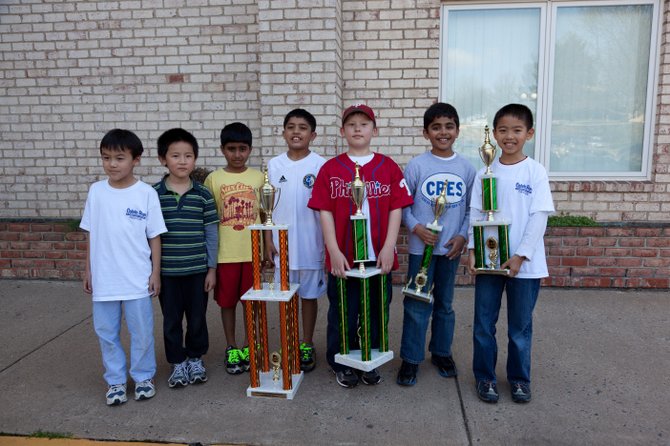 Colvin Run Elementary chess team displays trophies won at the championship.