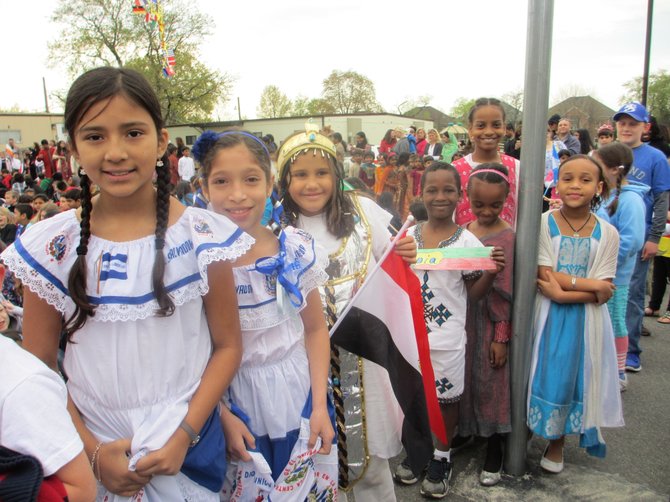 Smiling faces of Freedom Hill ES students show how similar people are the world over.