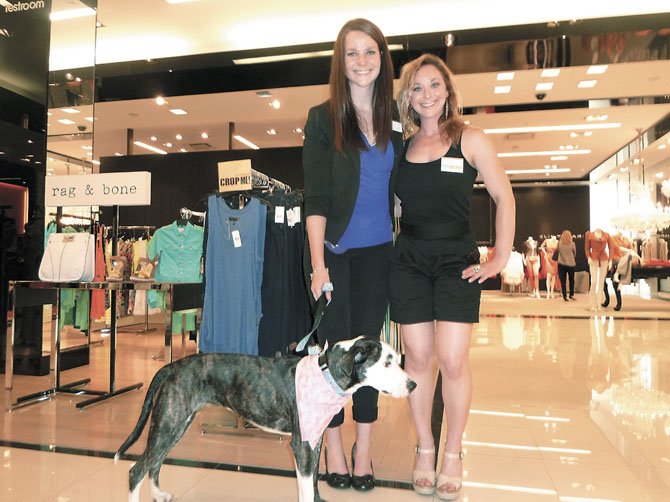 Juliana Willems, marketing and events director for the Montgomery County Humane Society, and Madeleine Mersky, volunteer for McPaw with Ruby, the adoptable shelter dog.
