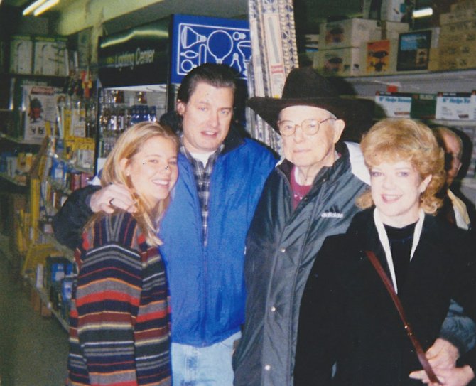 Lehman H. Young celebrated a portion of his 82nd birthday in 1998 at Fairfax Hardware. He is standing with his niece, Linda Young; nephew, Howard Young; and daughter Deborah Young.