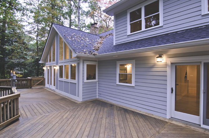 Window walls, glass-facing sliders and other glazing solutions mean that any seat in the primary living area is visually linked to the wooded setting.