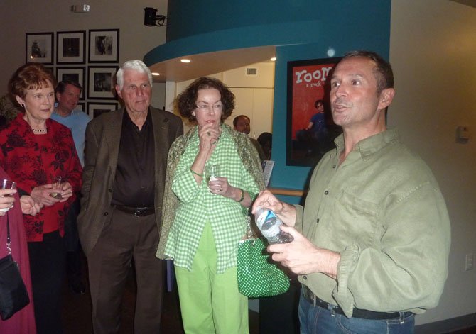 Jay Alvarez talks with audience members following a performance of “Be Careful! The Sharks Will Eat You” at MetroStage.
