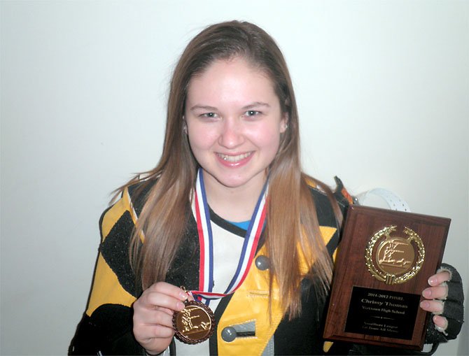 Chrissy Thomas with her medal for third place Potomac Rifle League and plaque naming her to the First Team All-Met.
