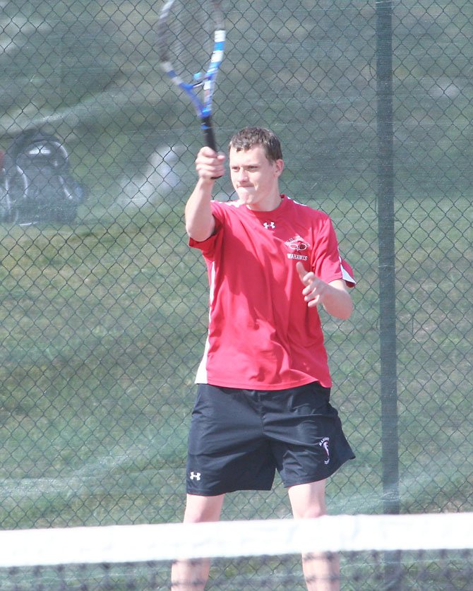 Madison High senior John Adam, shown here in his team's road match at South Lakes earlier this week, has played at No. 1 singles throughout the spring season for the Warhawks.