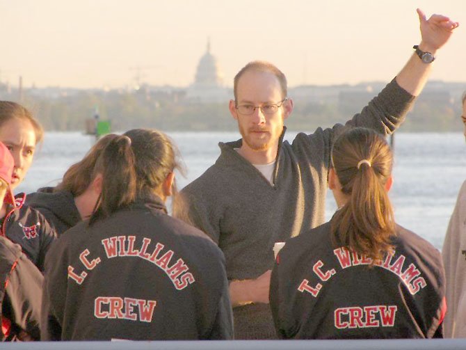 T.C. Williams girls’ coach Pat Marquardt talks to some of his rowers before the start of the time trial and intra-squad scrimmage at the Dee Campbell Boathouse on April 7.
