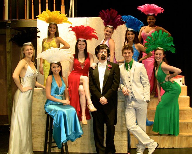 The follies girls pose with male leads (from left) Joey Biagini and Colby Dezelick in Westfield’s "Crazy for You."