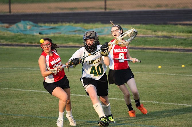 In a recent girls' lacrosse game between the Saxons and Highlanders, Langley goalie Erin Long (40) saves the ball in heavy traffic. This past Friday night, Long had a terrific outing for the Saxons in their victory at Madison. 