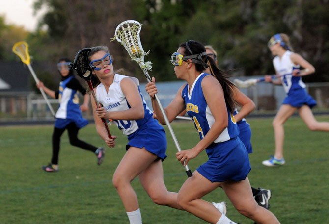 West Potomac senior Emily Hauptle, left, will play lacrosse at Marquette University.