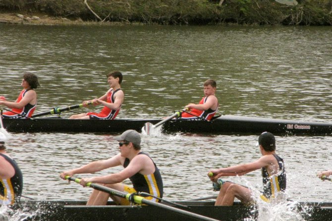 Rower Jack Kane (in the bow seat, top right) stares down the competition as the T.C. Williams boys’ freshman 8 storms past Bethesda-Chevy Chase on their way to victory at the Darrell Winslow Regatta on April 14.