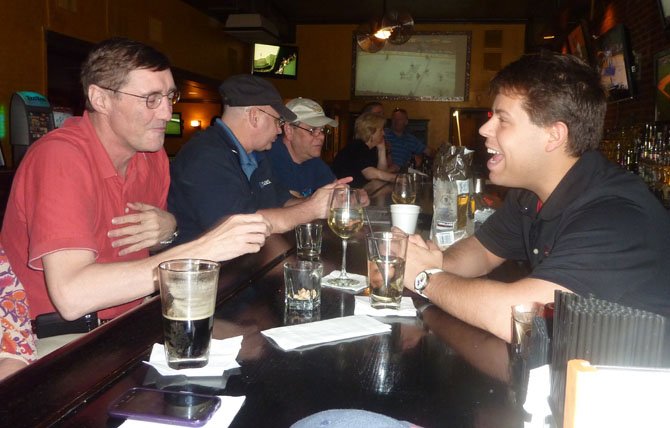Ramparts patron Gary Holme, left, shares a laugh with bartender Buster Didas. A former smoker, Holme supported the change to a no smoking policy.
