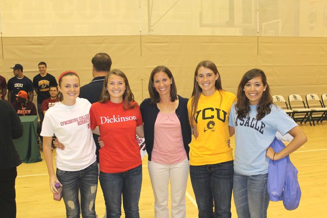 From left to right: South County Secondary girls' field hockey players Meredith Bradsher and Caroline Karwel; head coach Leah Conte; and players Kendall Clifton and Kaylee Taillon. The four Stallion players have each made commitments to play field hockey in college.