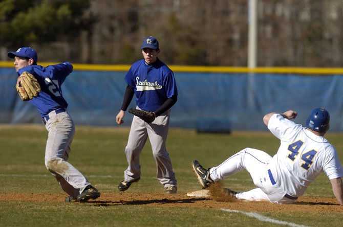 Robinson sophomore Jake Pinkston makes a slide into second base during a Rams' early season baseball scrimmage game versus South Lakes.