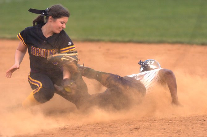 Lake Braddock shortstop Mallory Gerndt attempts to tag South County’s Whitney Burks during the teams’ April 17 meeting at Lake Braddock Secondary School.