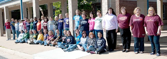 Friday April 13 was "College Day" in the Chantilly Pyramid and all faculty and staff were encouraged to wear a shirt from their alma mater and to engage their students in discussions about college and careers. The effort was part of a "Crayon to College" initiative, acknowledging research that suggests that the earlier students start thinking about possible careers, the better they plan their educational paths. Here, some administrators and faculty of Lees Corner Elementary School pose for a group shot in their spirit wear.