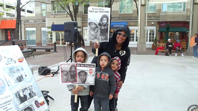 A family joins the vigil for Trayvon Martin at Reston Town Center Tuesday, April 7. 