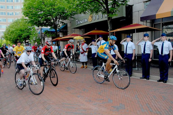 Alexander leads the riders out of Reston Town Center for the start of the 53-mile ride. Standing at attention were members of the Battlefield High School JROTC (Junior Reserve Officer Training Corps), from Haymarket.