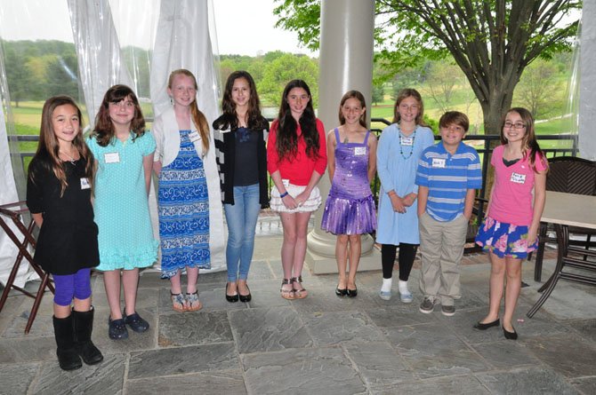 From left, Great Falls Elementary students Rachel Vanderven, Maddie Cross, Sabrina Barker, Nicole Medina, Hannah Femia, Laura Gersony, Olivia Garner, Nicholas Trunnell and Sonia Toloczko, winners of the annual Great Falls Friends and Neighbors Poetry Contest. 