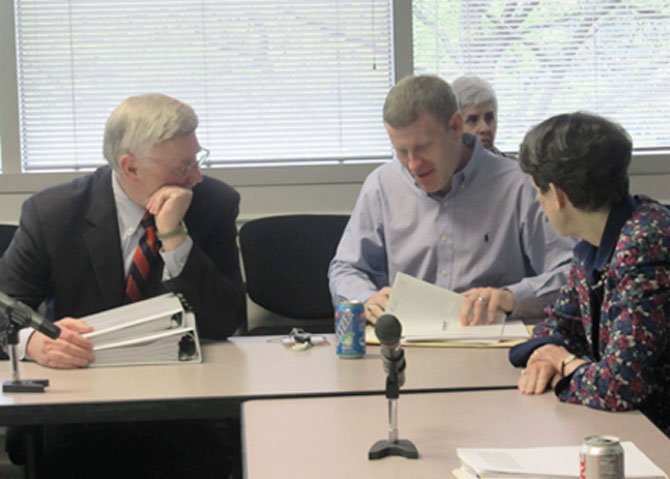 Supervisor John Foust (D-Dranesville) confers with Supervisors Jeff McKay (D-Lee) and Linda Smyth (D-Providence) before the budget mark-up session on Friday, April 20.